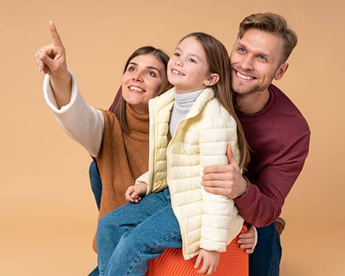 Young family smiling together after getting homebuyer assistance in Texas
